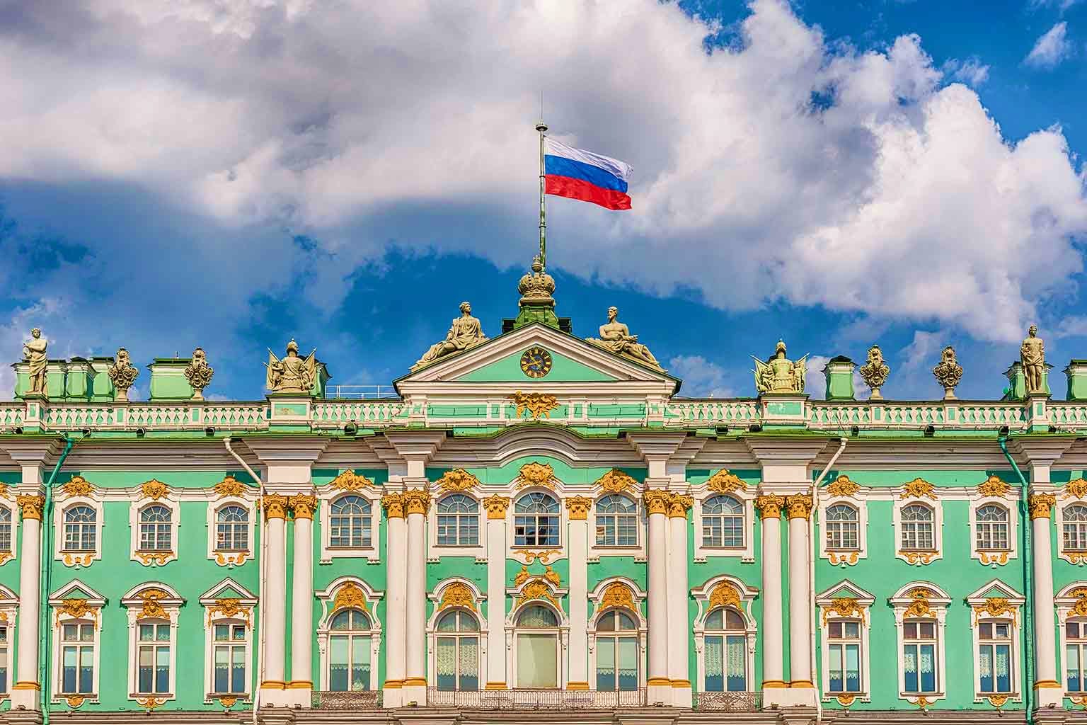 Russia Visa Russian flag flying above ornate green and gold neoclassical government building with white columns and decorative architectu